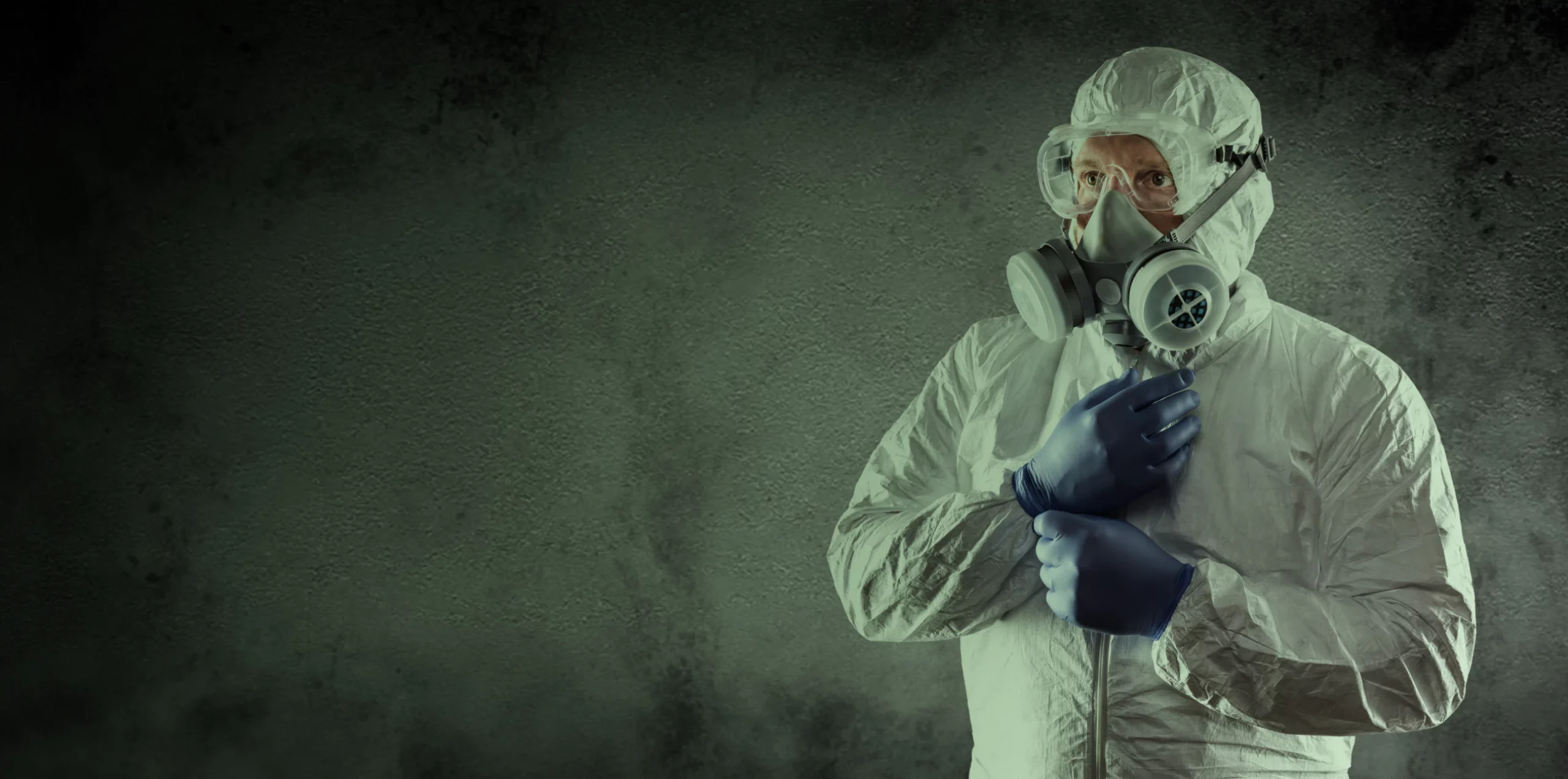 man wearing protection suit for radon service monroe nc